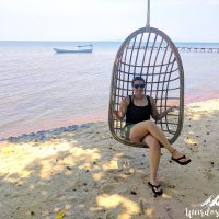 Enjoying a swing by the sea