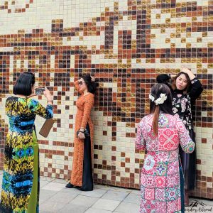 Posing in front of a mural