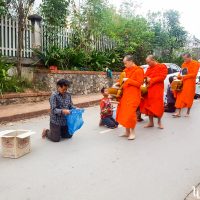 Monks redistributing their donations to people in need