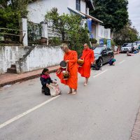 Monks redistributing their donations to people in need