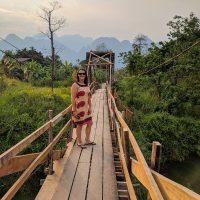 Perine on a bridge at sunset