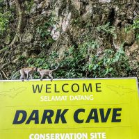 Youngsters playing around at the entrance of the Dark Cave