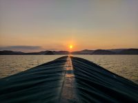 Sunset from the top of the boat after a full day of activities.