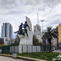 Don Quixote Statue and Eva Peron mural in the back